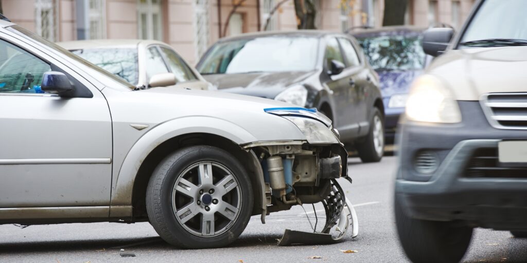 A personal injury attorney at Reinfeld Cabrera Tison (RCT Law) in Coral Springs reviews highway crash reports and evidence data during a multi-vehicle accident case study consultation.