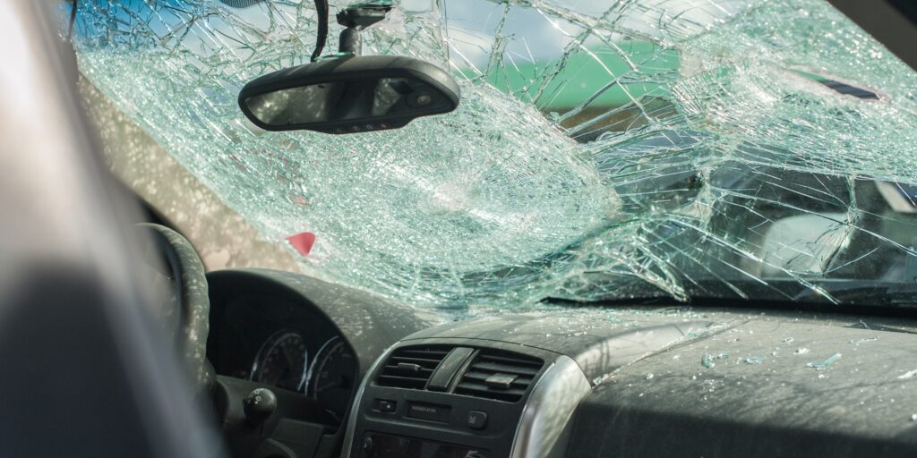 A personal injury attorney at Reinfeld Cabrera Tison (RCT Law) in South Florida reviews rideshare insurance tiers and intersection traffic camera evidence during a case study consultation.