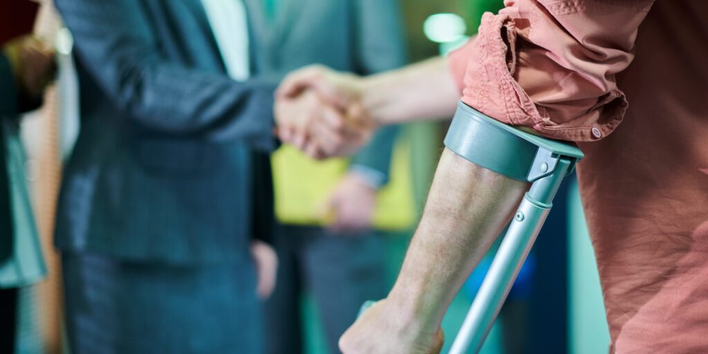Client recovering from an accident with crutches after meeting with a personal injury lawyer in South Florida.